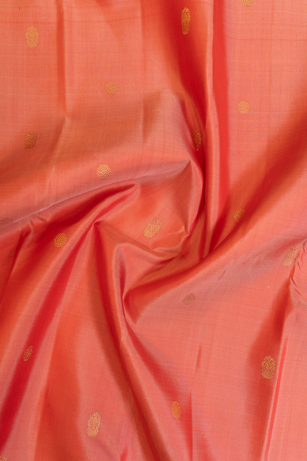 Coral fabric with gold patterns