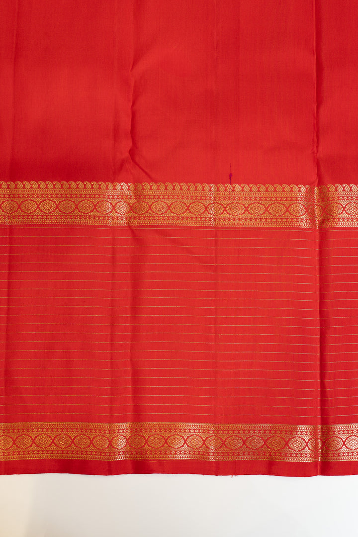 Red fabric with gold border on a white background