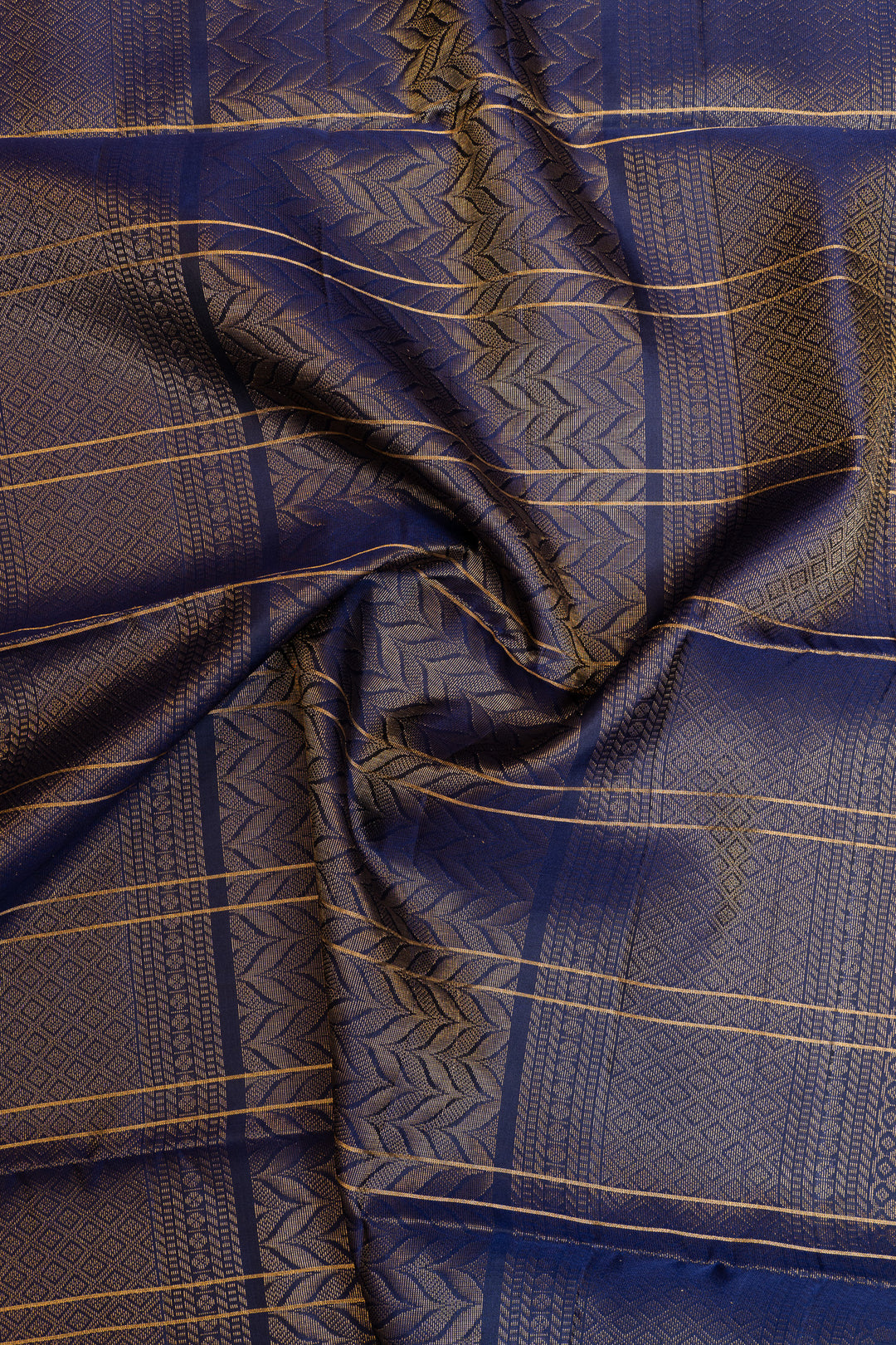 Close-up of blue fabric with gold patterns