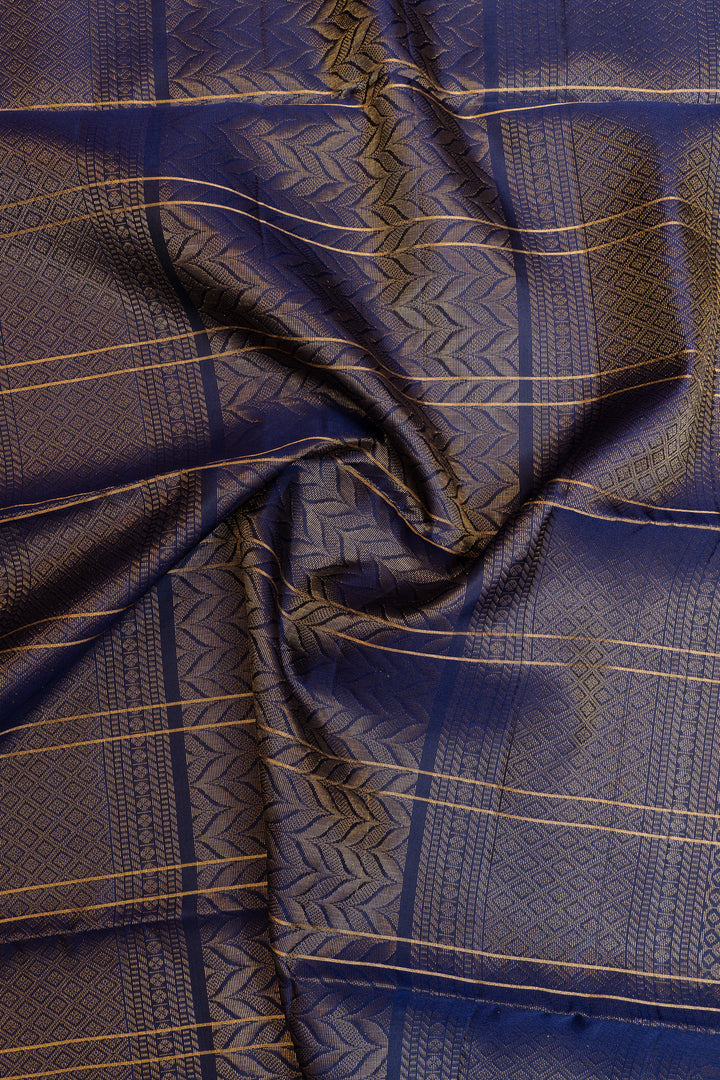 Close-up of blue fabric with gold patterns
