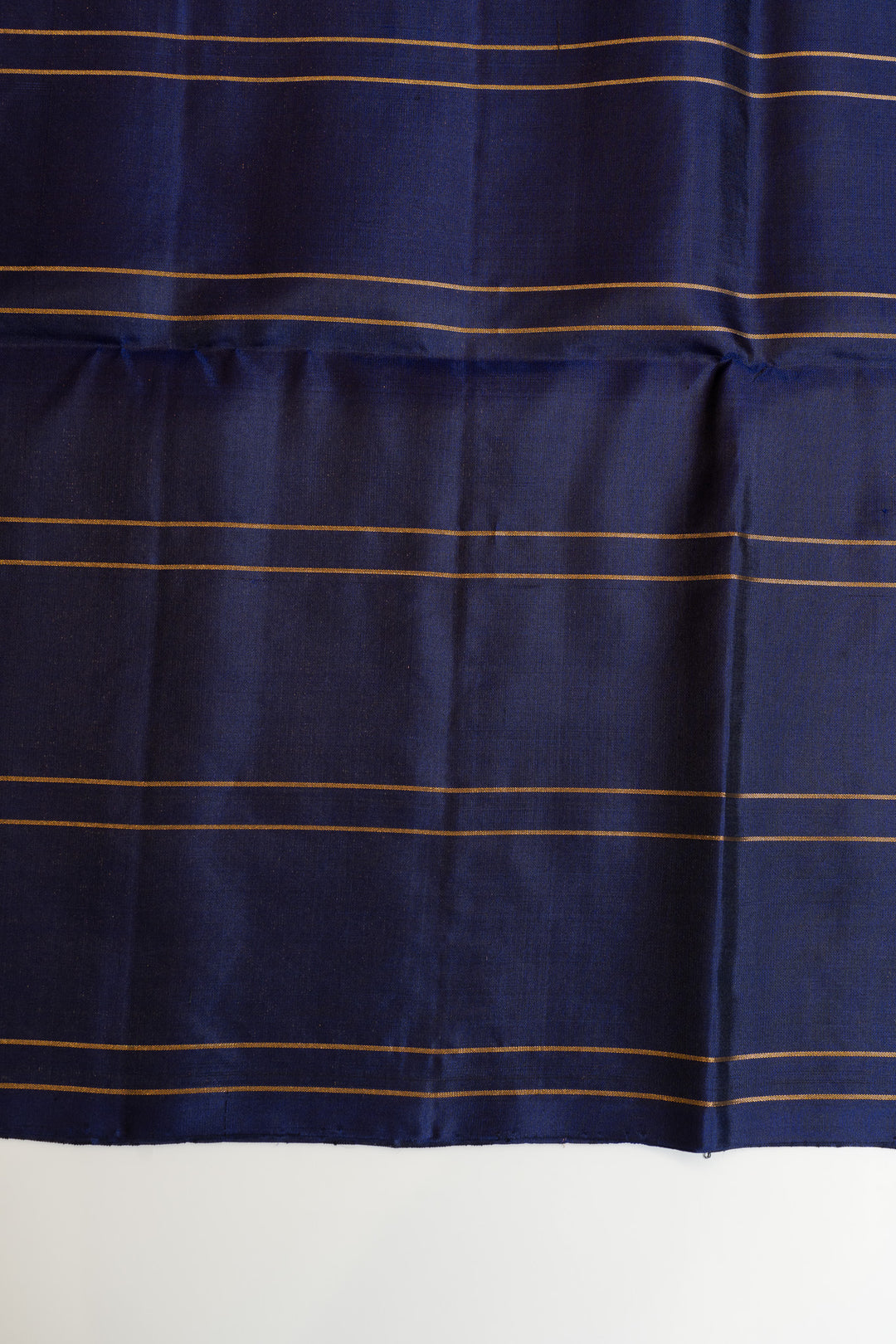 Navy blue fabric with gold stripes on a white background