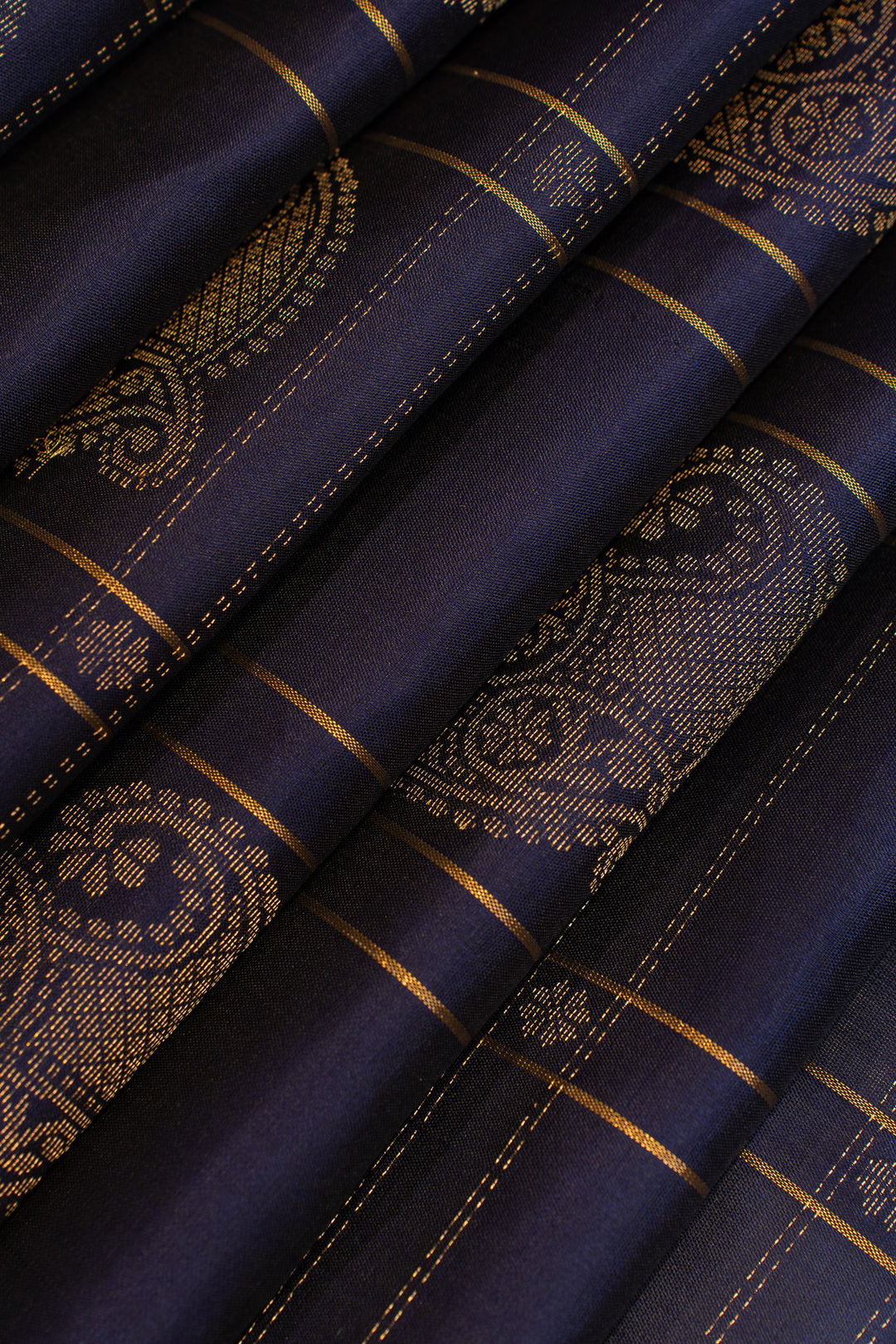Navy fabric with gold embroidery and stitching