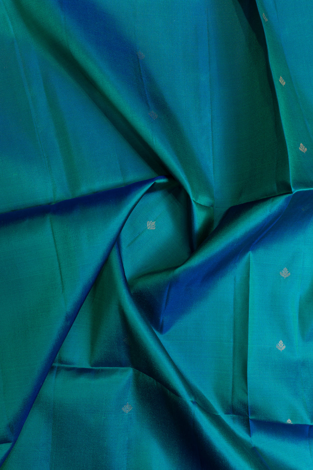 Close-up of teal fabric with subtle patterns