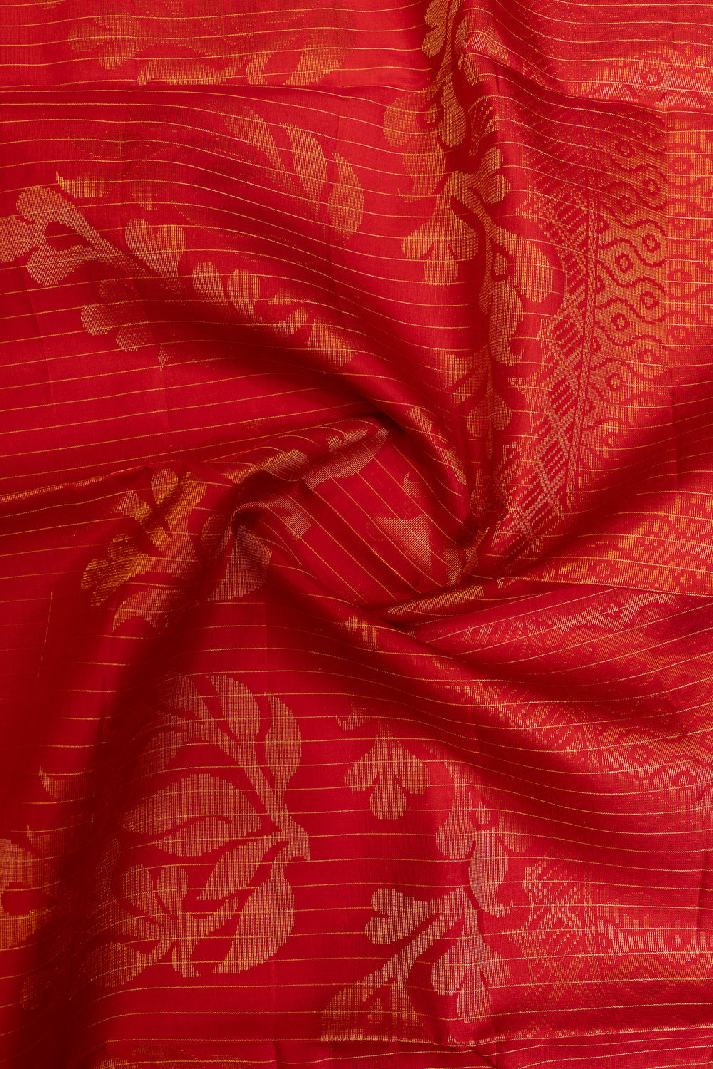 Red fabric with intricate gold patterns
