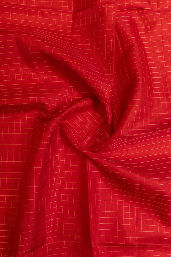 Close-up of red fabric with a subtle grid pattern
