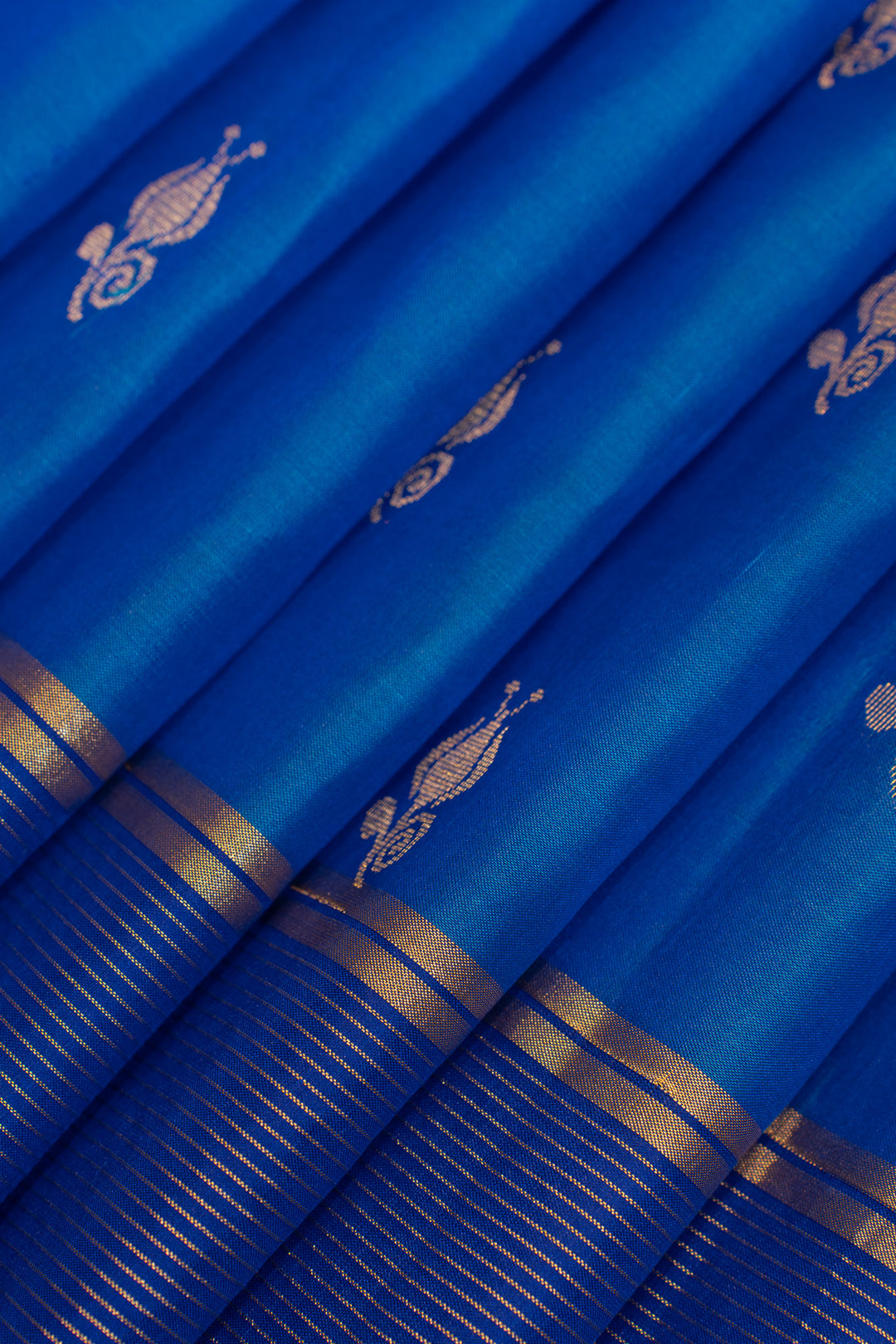 Blue fabric with gold embroidery and border
