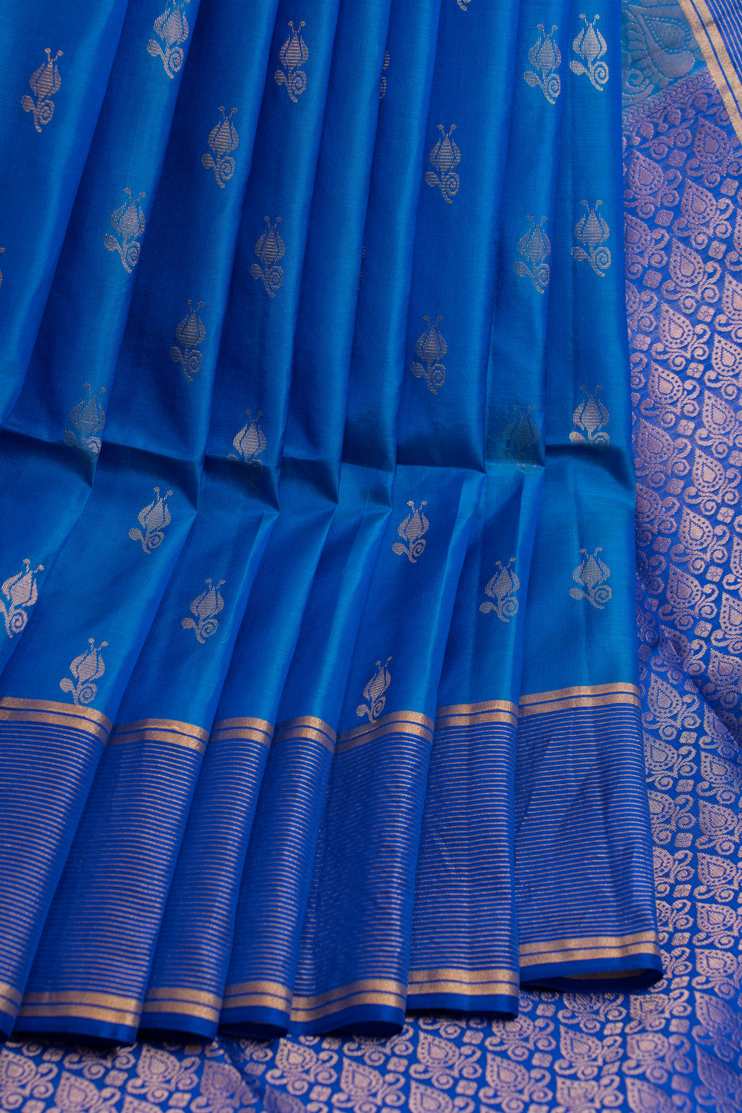 Blue saree with gold border and patterns