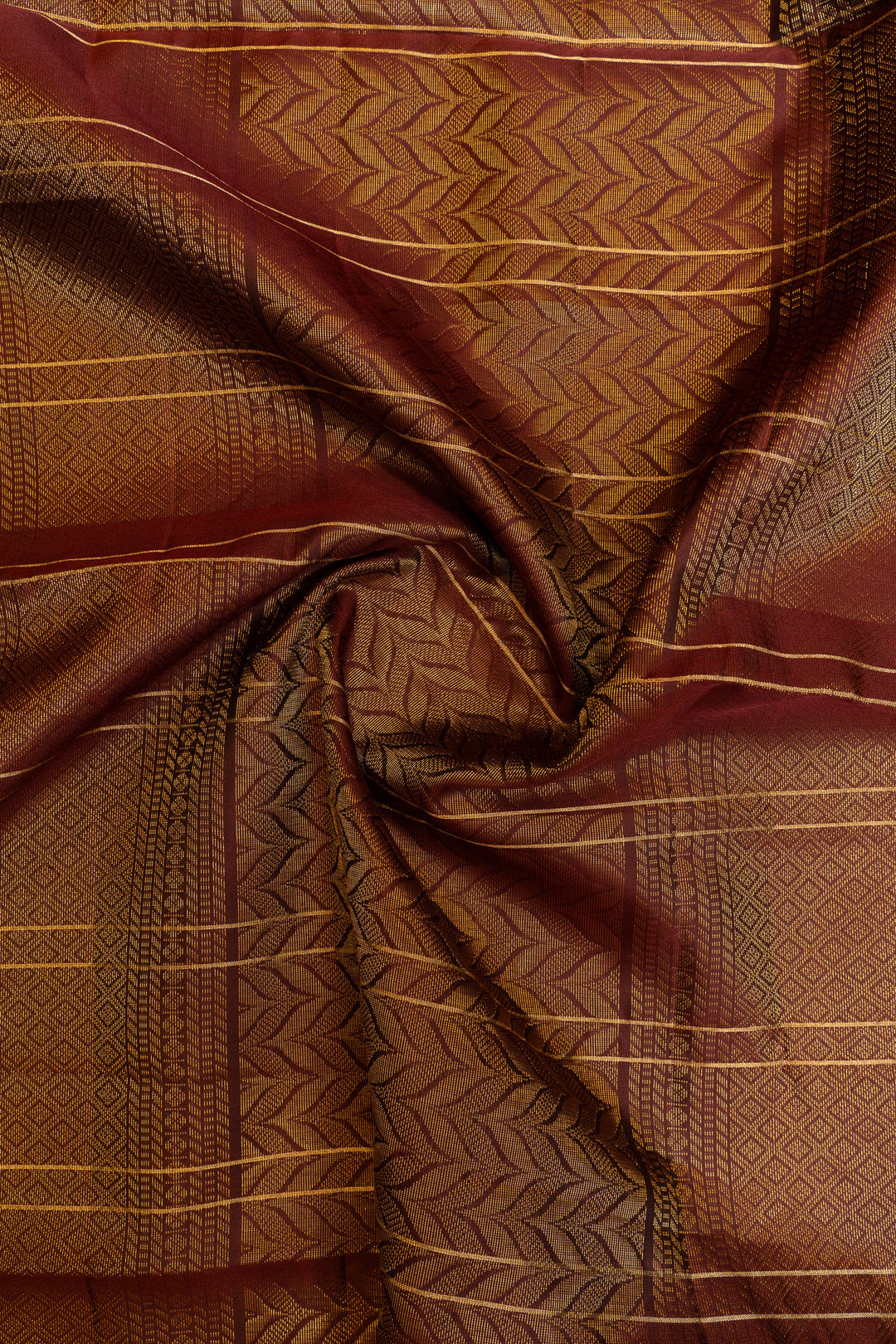 Brown fabric with intricate patterns and stripes