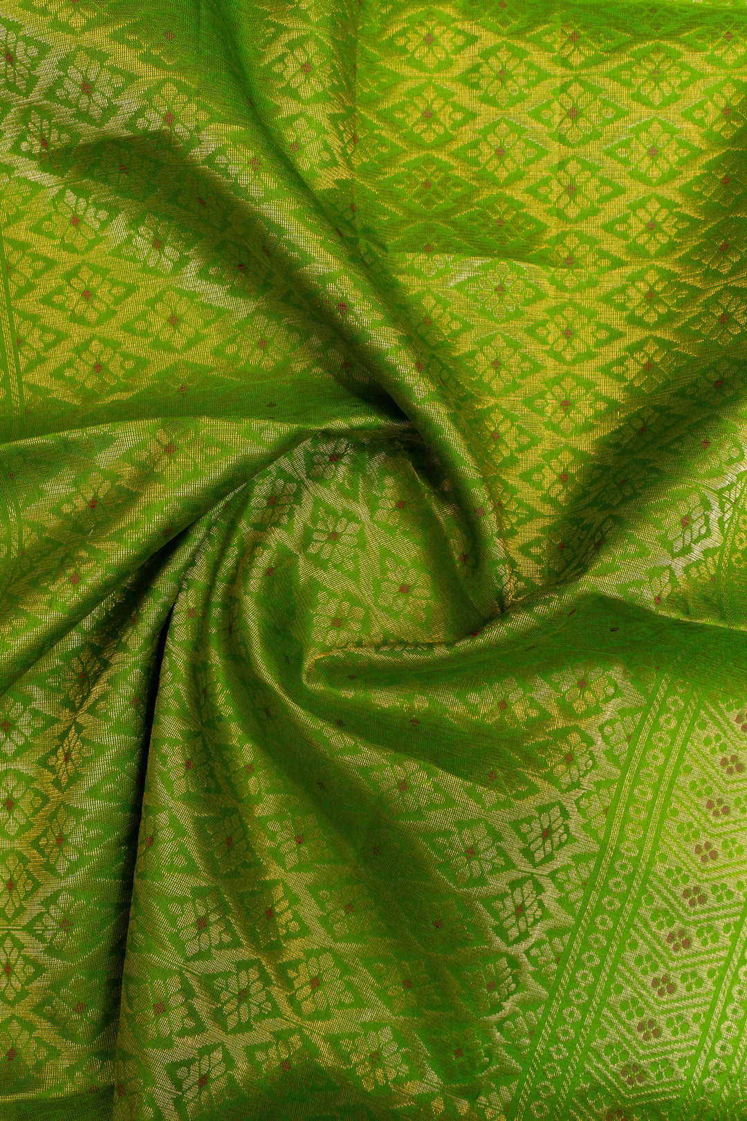 Close-up of green fabric with intricate patterns
