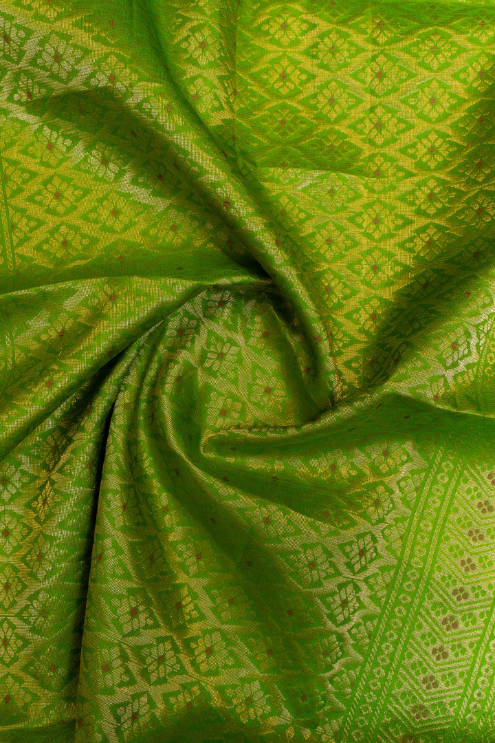 Close-up of green fabric with intricate patterns