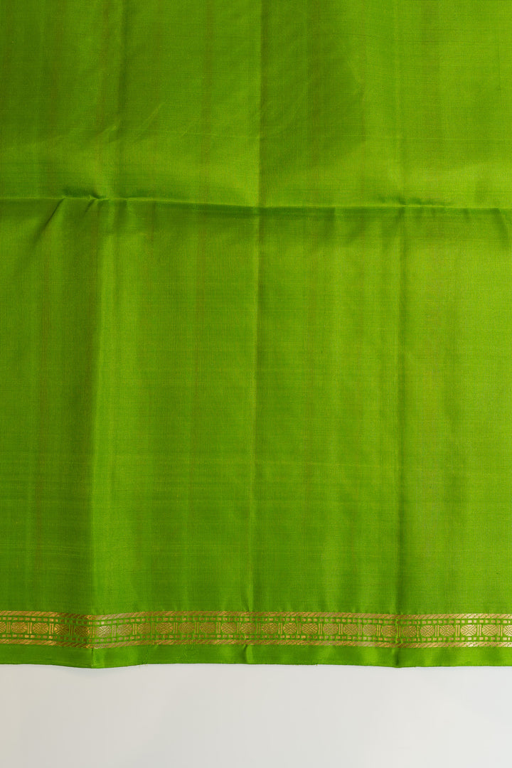 Green fabric with a gold border on a white background