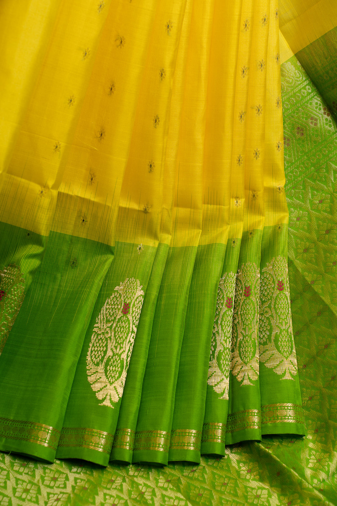 Green and yellow saree with intricate patterns