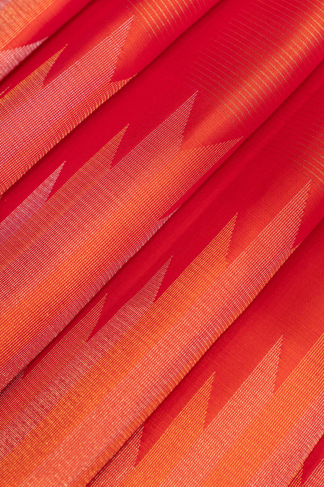 Close-up of red and orange fabric with geometric pattern