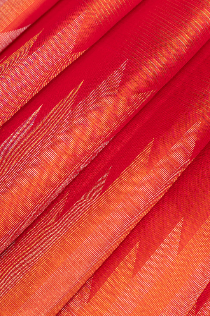 Close-up of red and orange fabric with geometric pattern