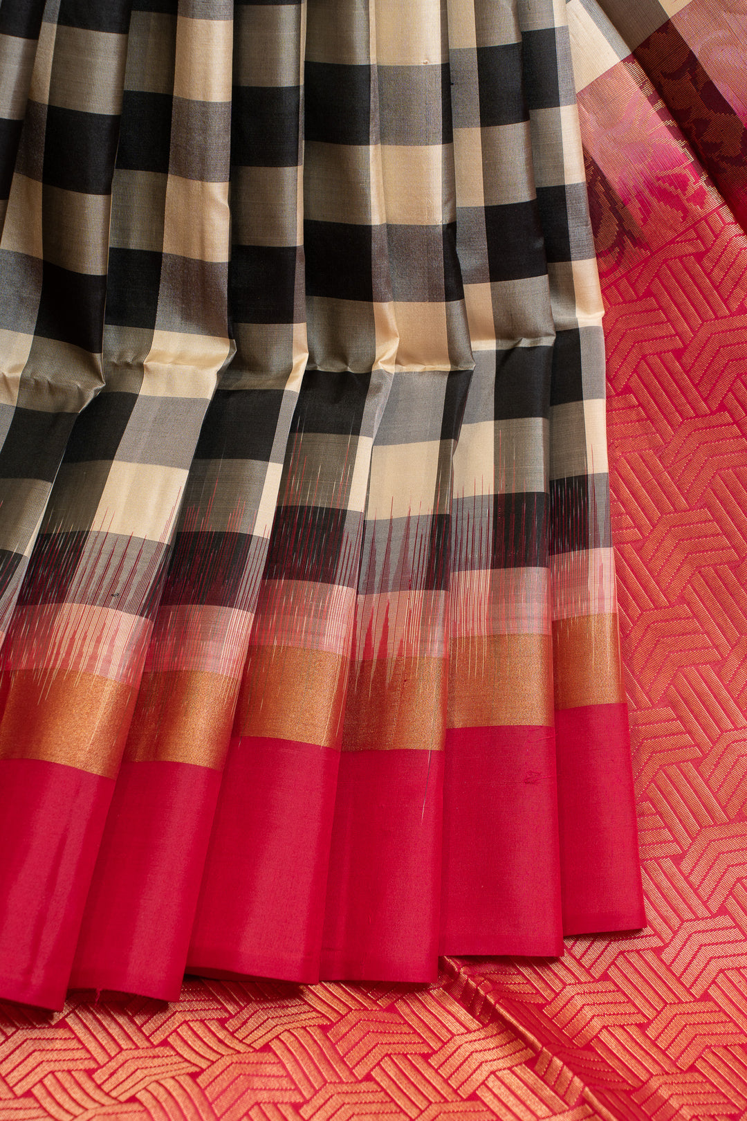 Checkered fabric with red border on a textured red background