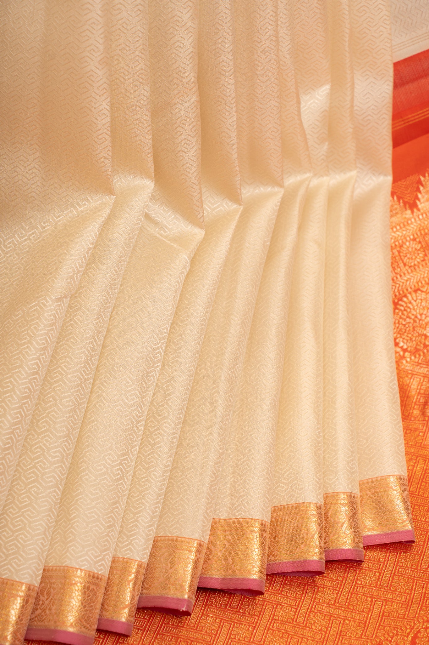 Pearl white embossed pure Kanchipuram silk saree