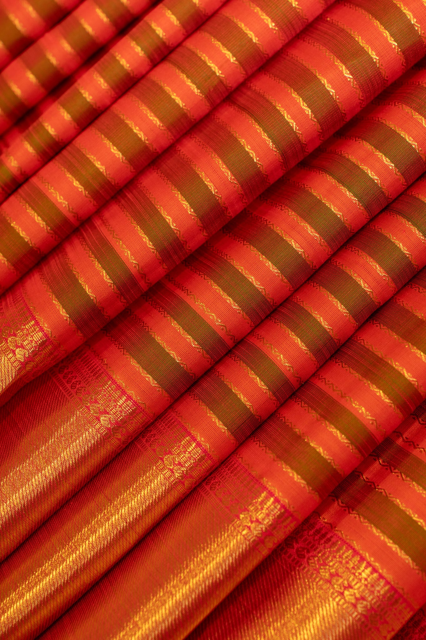 Rust orange and mandhulir green neli stripes pure zari Kanchipuram silk saree