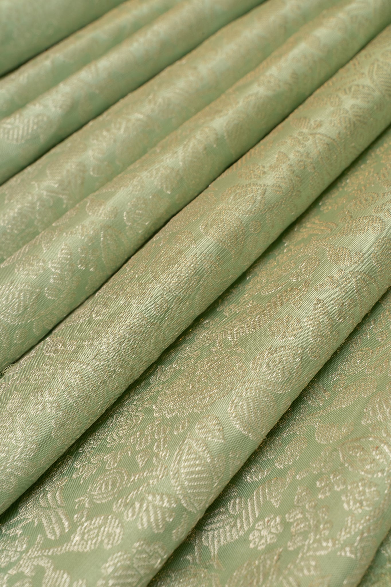 Pastel green borderless pure brocade Kanchipuram silk saree