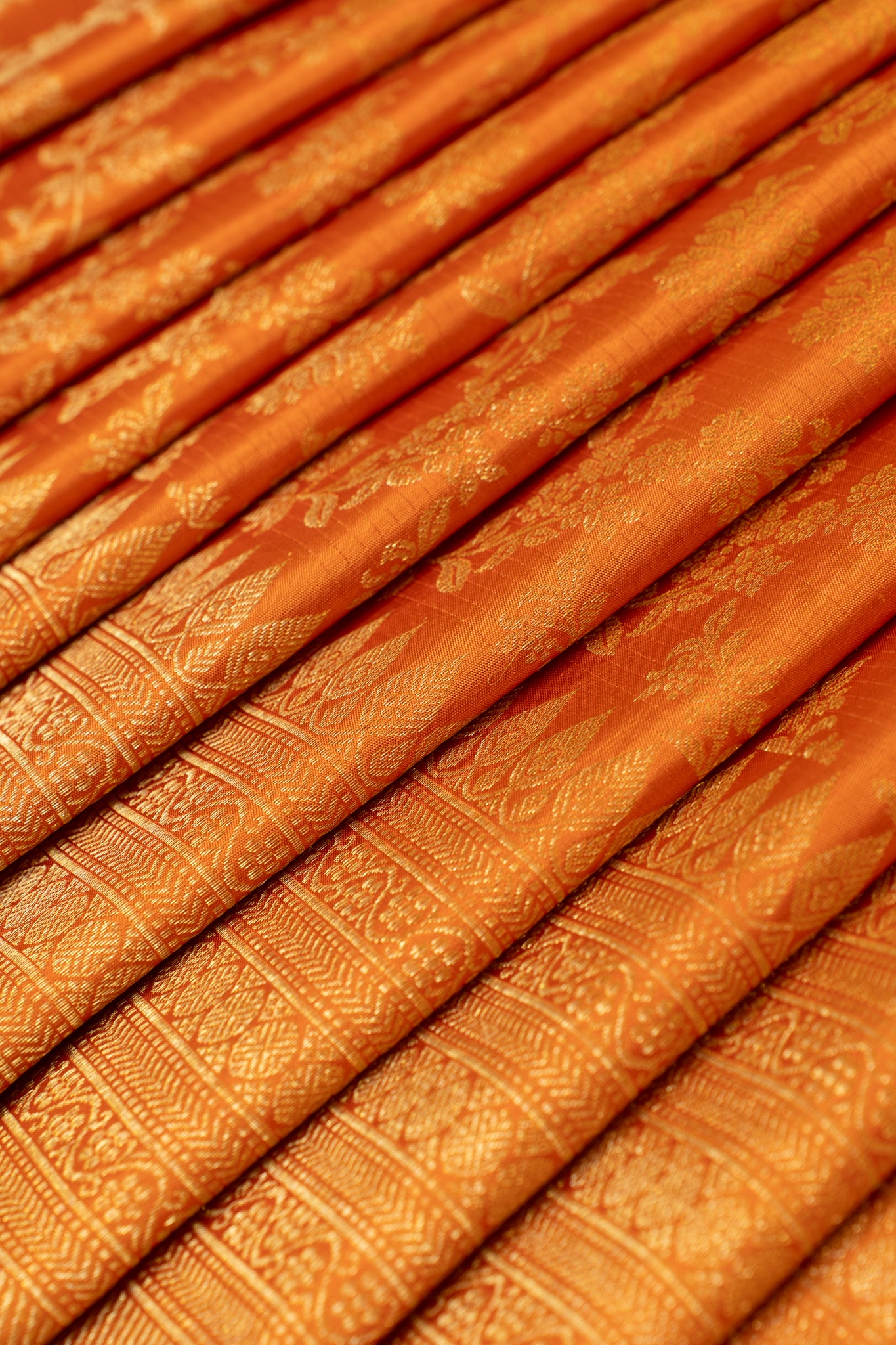 Rust orange floral brocade turning border pure Kanchipuram silk saree