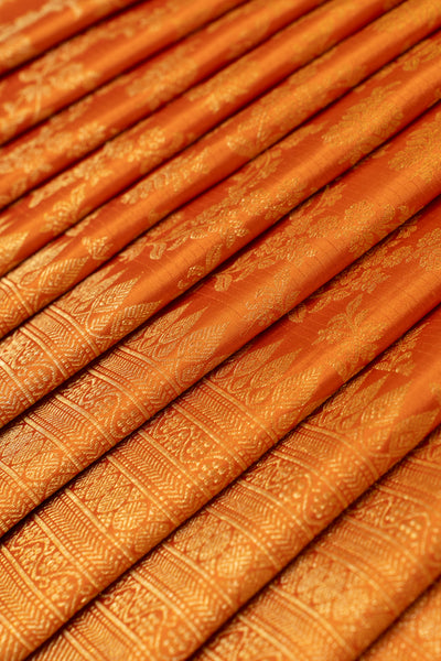 Rust orange floral brocade turning border pure Kanchipuram silk saree