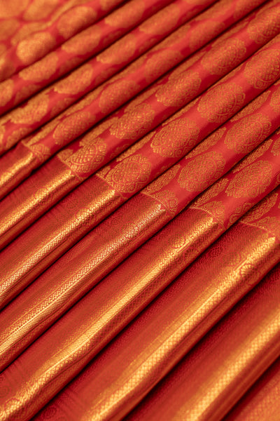 Reddish orange chakram brocade pure Kanchipuram silk saree