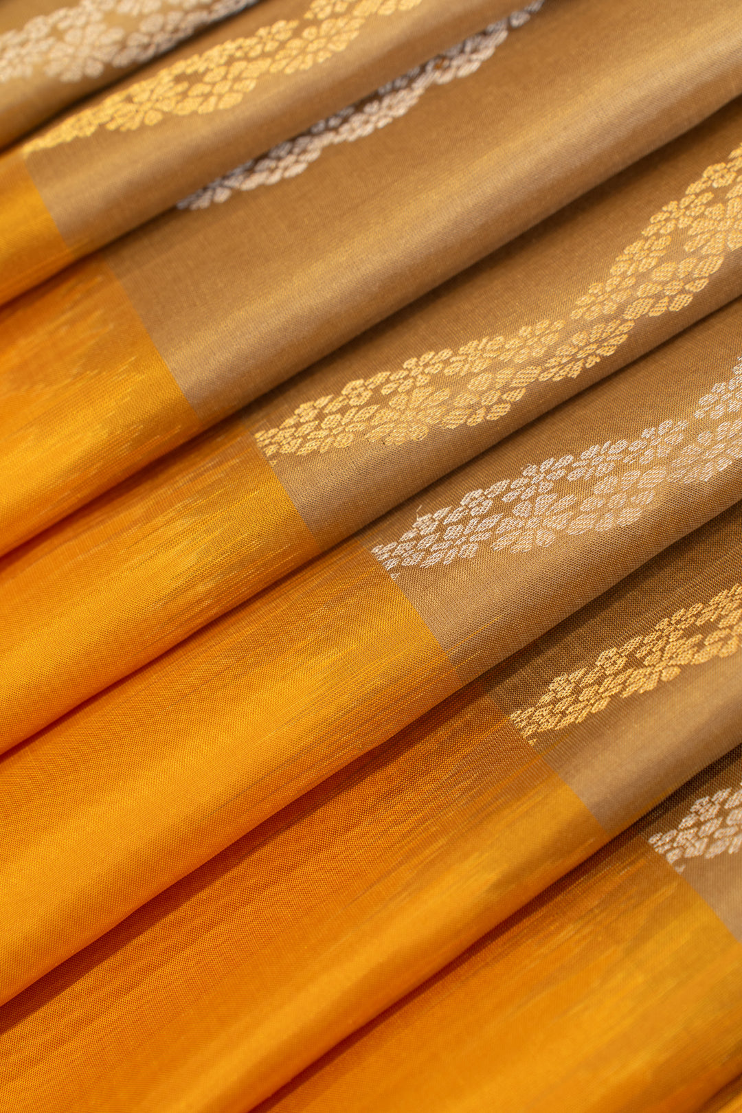 Beige and yellow ornamental&nbsp;Stripes pure soft silk saree