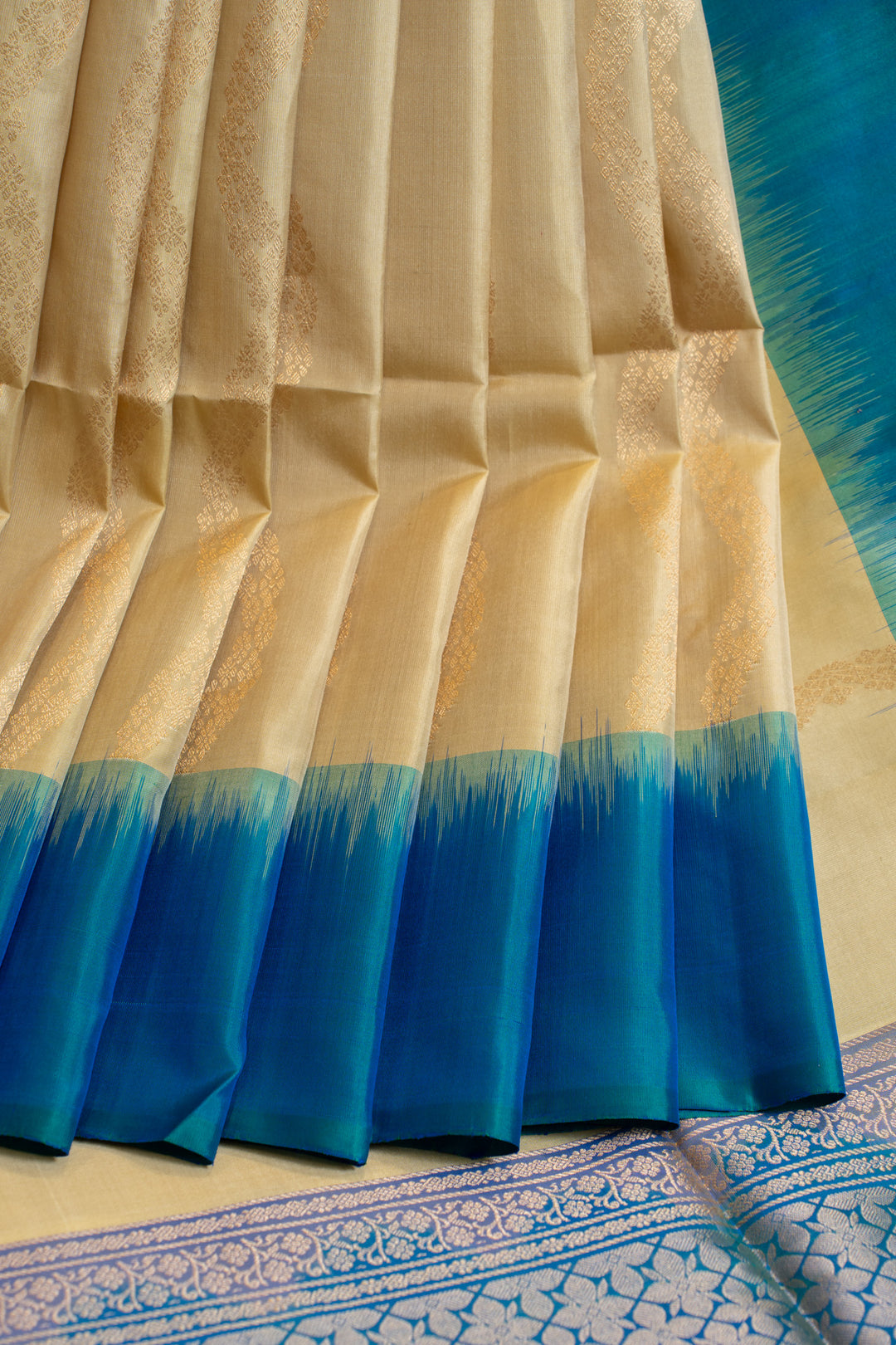 Beige and peacock blue ornamental stripes pure soft silk saree