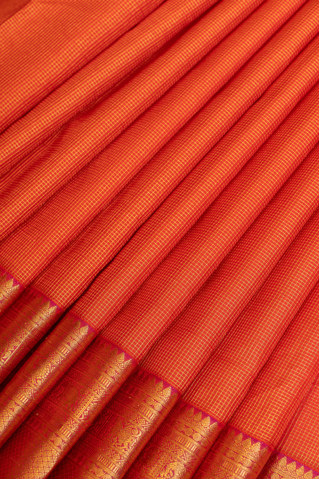 Reddish orange muthuzari pure Kanchipuram silk saree