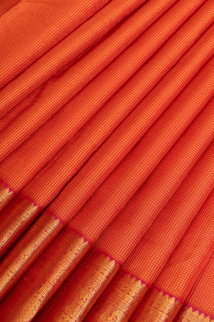 Reddish orange muthuzari pure Kanchipuram silk saree