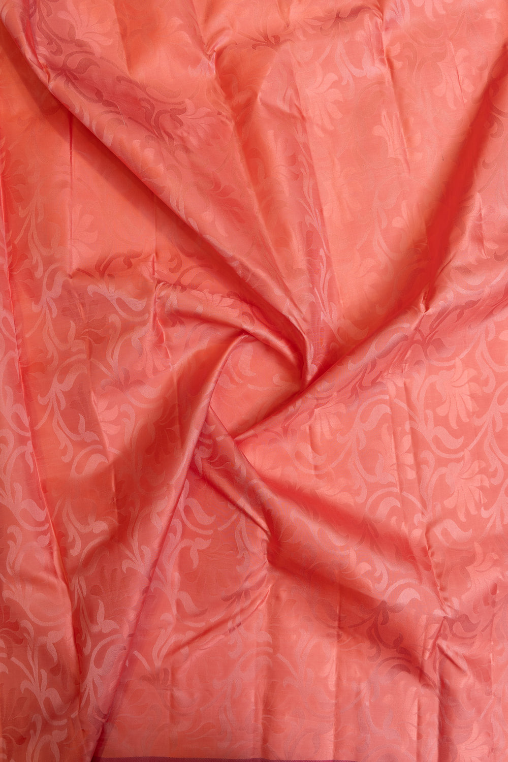 Peach embossed pure Kanchipuram silk saree