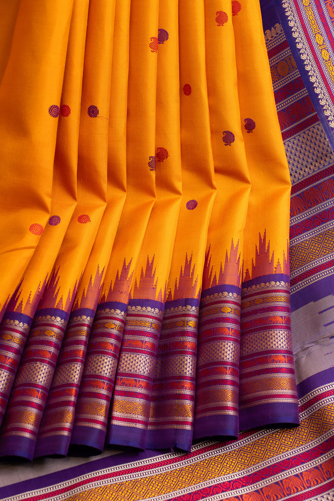 Mustard yellow and purple threadwork Kanchipuram silk saree