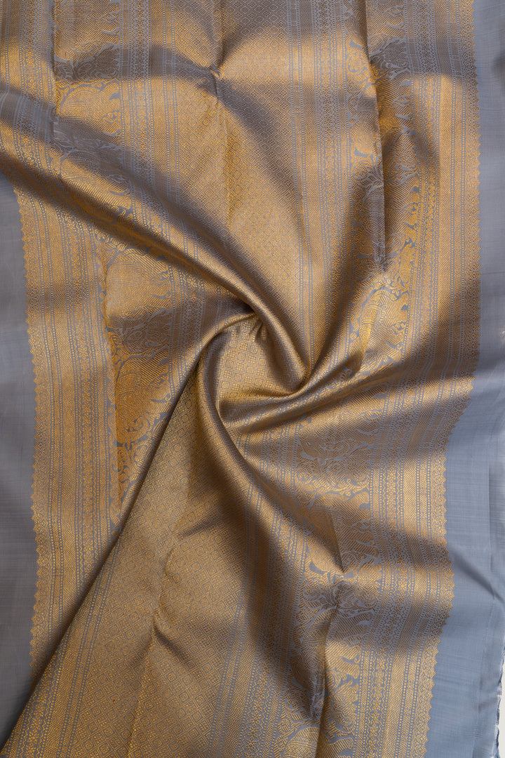 It’s orange and grey pure Kanchipuram silk saree