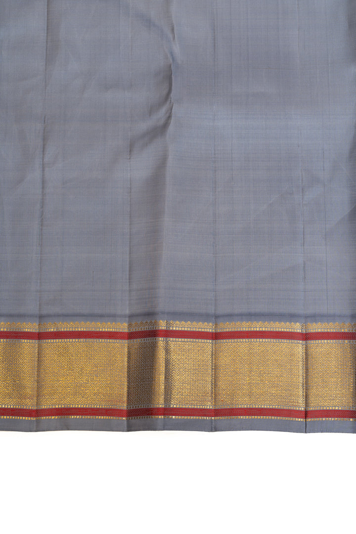 It’s orange and grey pure Kanchipuram silk saree