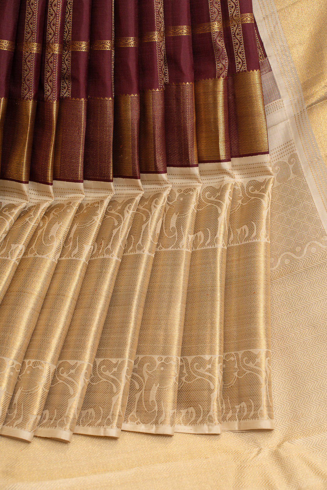 Jamun maroon and ivory yazhi border pure Kanchipuram silk saree