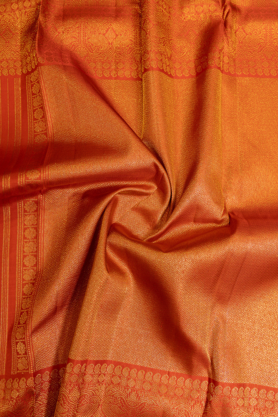 Rust orange paisley pure Kanchipuram silk saree
