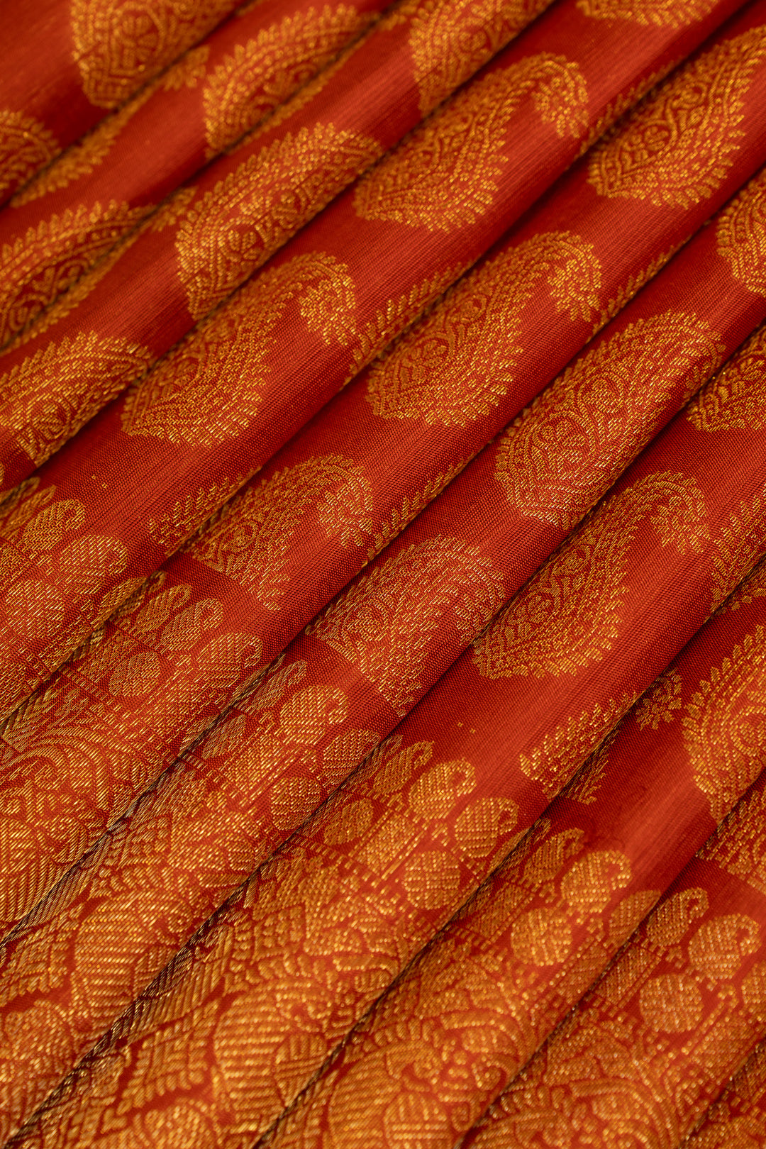 Rust orange paisley pure Kanchipuram silk saree