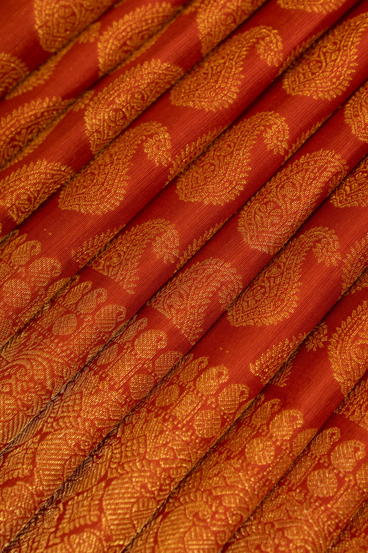 Rust orange paisley pure Kanchipuram silk saree