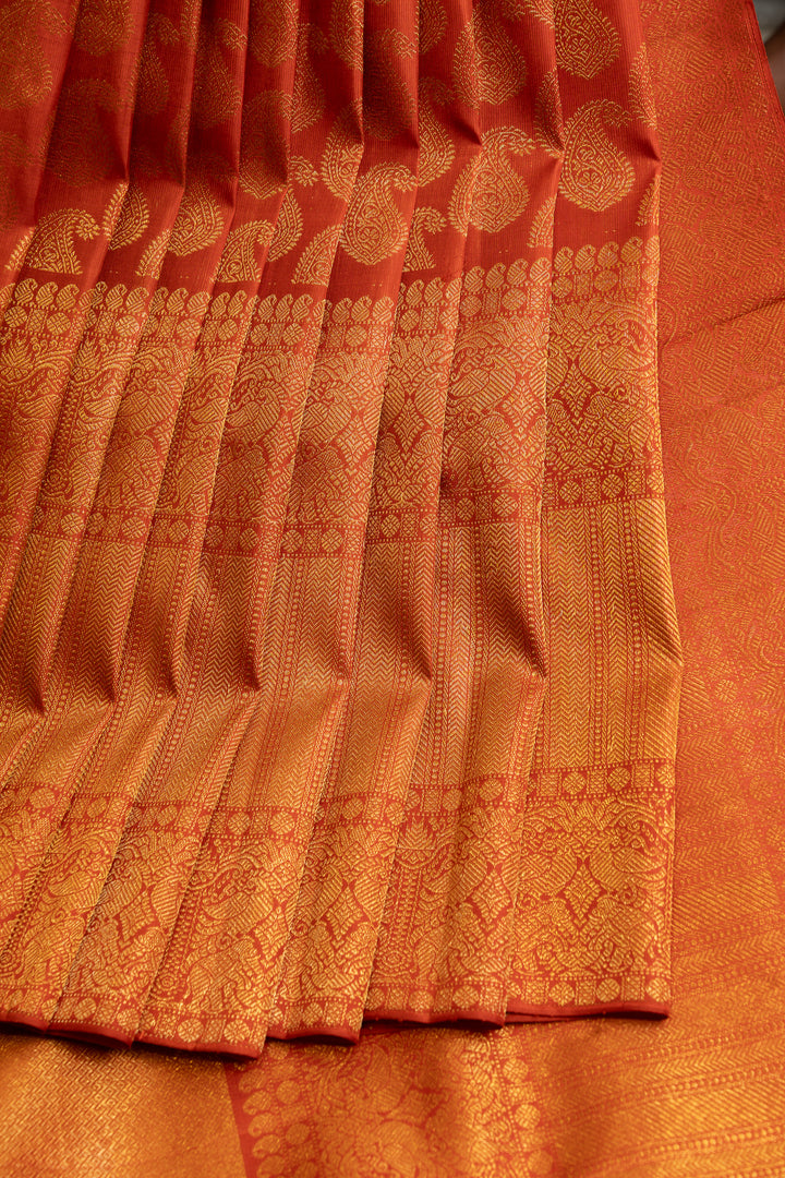 Rust orange paisley pure Kanchipuram silk saree