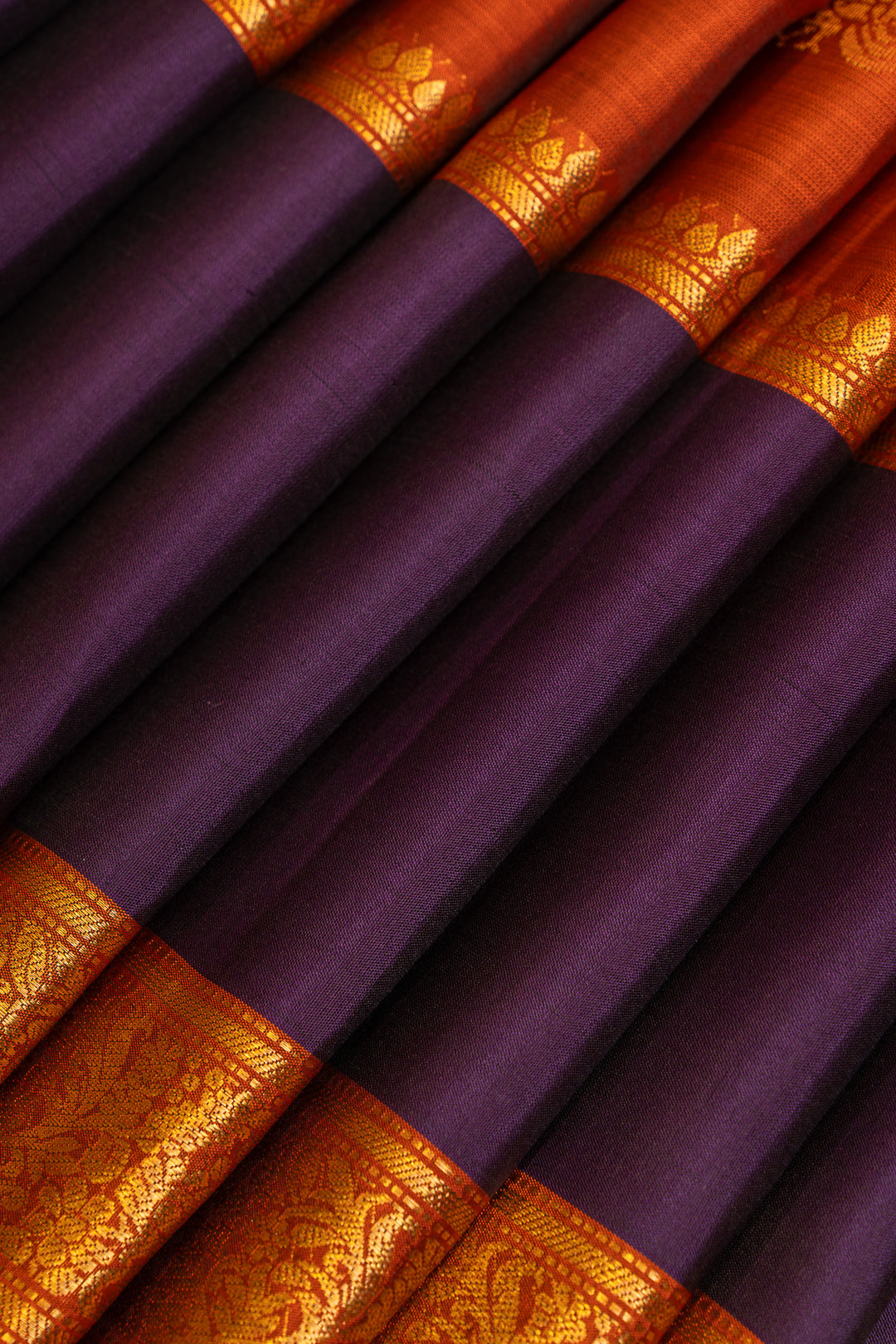 Rust orange and purple pure soft silk saree