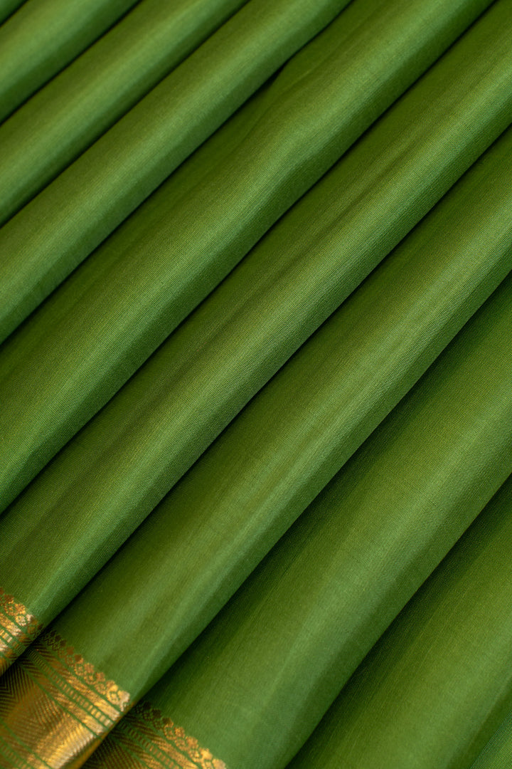 Pine green small border pure Kanchipuram Silk saree