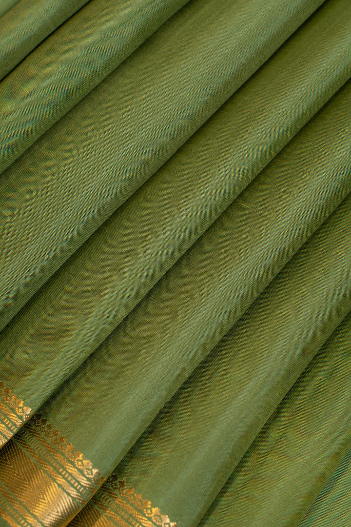 Green small border pure Kanchipuram silk saree