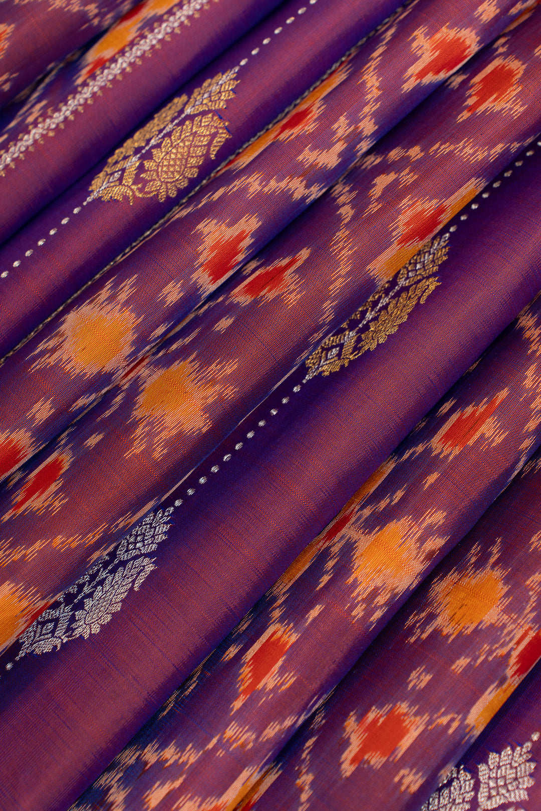 Purple borderless pure ikat Kanchipuram silk saree
